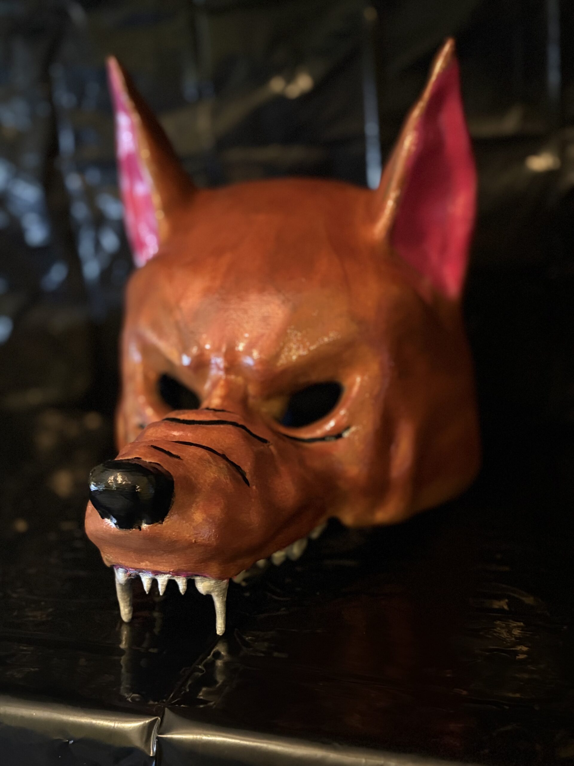 3D printed feral wolf mask with sharp fangs and brown hand-painted finish.